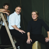 Take That stood on a ladder
